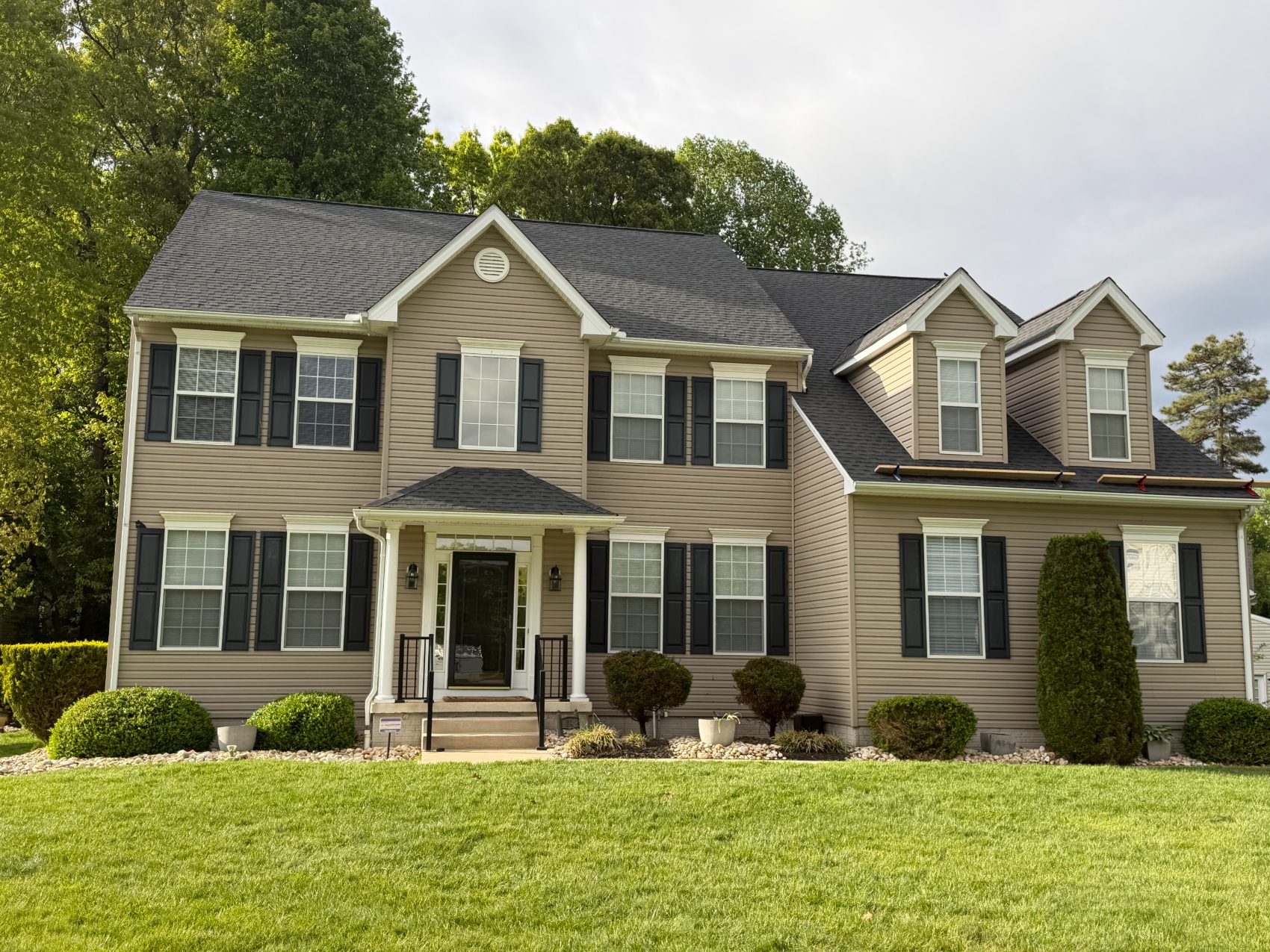 Completed roof replacement on a large two-story home